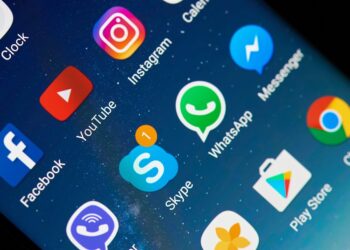 New york, USA - May 22, 2017: Social media icons on modern screen smartphone device. New message in Skype application