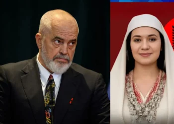 Perdana Menteri Albania Edi Rama di sebelah avatar digital Menteri AI pertama di dunia dengan latar bendera Albania.