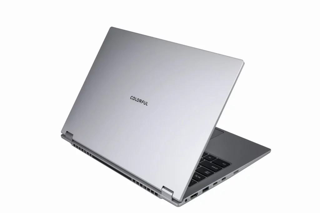 Tampilan belakang laptop Colorful Rimbook S1 berwarna silver, menunjukkan desainnya yang ramping dan port konektivitas di bagian samping.