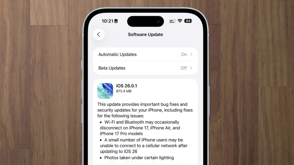 Tangkapan layar changelog resmi update iOS 26.0.1 yang menampilkan daftar perbaikan bug konektivitas dan kamera.