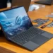 Asus ROG Flow Z13, salah satu laptop 2-in-1 terbaik, diletakkan di atas meja dengan kickstand dan keyboard terpasang.