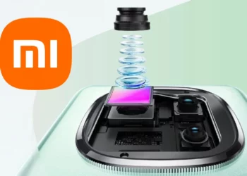 Ilustrasi sensor kamera 200MP Xiaomi dengan logo Mi di samping modul kamera canggih yang menunjukkan tumpukan lensa dan sensor.