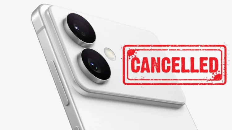 Gambar closeup bagian belakang smartphone putih dengan dua lensa kamera menonjol, dan stempel merah bertuliskan "CANCELLED" menutupi bodi ponsel. Ilustrasi ini menggambarkan pembatalan peluncuran Galaxy S26 Edge oleh Samsung.