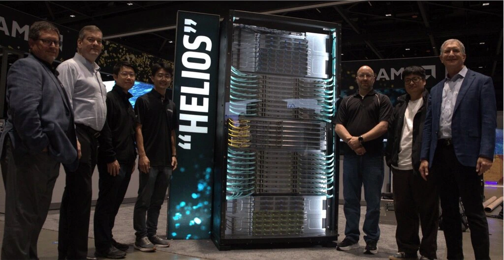Tim eksekutif dan insinyur dari AMD dan Oracle berpose di samping rak server "Helios", arsitektur superkomputer AI baru yang menjadi bagian strategi AMD saingi NVIDIA.