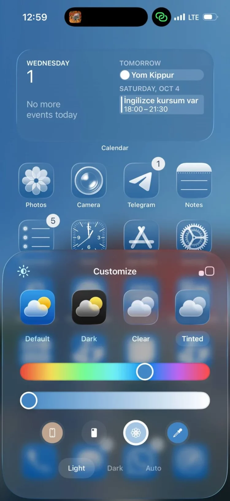 Tampilan antarmuka Apple iOS 26 dengan fitur Dynamic Island, yang dibandingkan dengan HyperIsland dalam pertarungan HyperOS 3 vs iOS 26.
