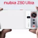 Tangan memegang Nubia Z80 Ultra warna putih, menyorot modul kamera 'Master 990' yang gahar, HP dengan baterai 7.200mAh.