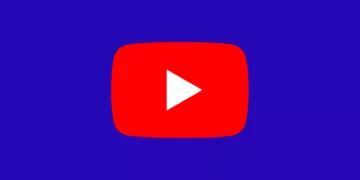 Logo play button merah ikonik YouTube di tengah latar belakang berwarna biru tua.