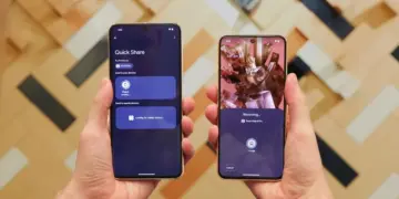 Tampilan smartphone Android dengan fokus pada ikon konektivitas atau fitur berbagi, menyoroti fungsi Quick Share.