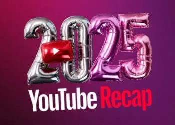 Smartphone modern dengan latar belakang teknologi dan cahaya, menyiratkan peluncuran fitur recap yang canggih dan personal.