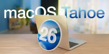 Logo macOS Tahoe dengan angka 26 di tengah diletakkan di depan laptop MacBook yang terbuka, menyoroti rilis update macOS Tahoe 26.2.