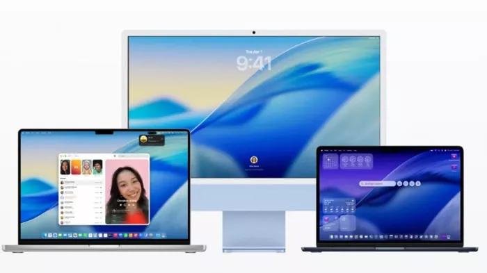 Tampilan interface macOS Tahoe 26.2 di tiga perangkat (iMac, MacBook Pro, MacBook Air), menyoroti desain wallpaper baru dan fitur Edge Light.