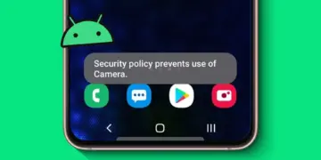 Munculnya pesan error Security policy prevents use of camera pada layar HP Android dengan ikon robot hijau.