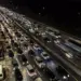 Pemandangan udara kemacetan parah di jalan tol pada malam hari saat arus mudik lebaran.