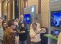 Presentasi solusi Ericsson Immersive Sports fan engagement berbasis teknologi 5G kepada pengunjung.