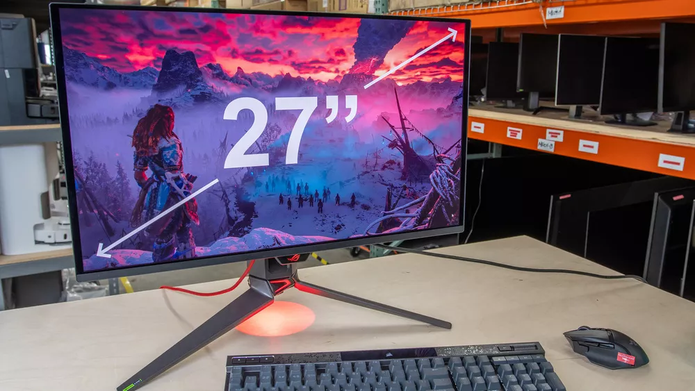 Monitor gaming ASUS ROG Swift 27 inci menampilkan visual game RPG Horizon Forbidden West dengan warna kontras tinggi.