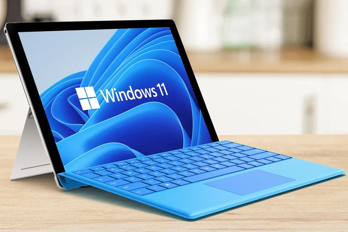 Perangkat tablet dengan wallpaper biru ikonik yang menjalankan sistem operasi Windows 11.