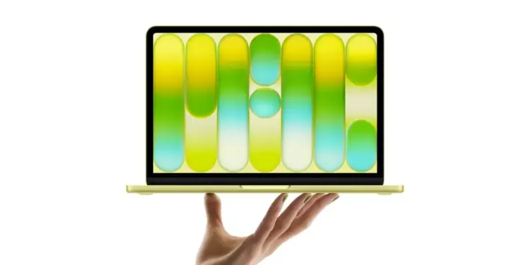 Satu tangan memegang MacBook Neo untuk menunjukkan betapa ringan dan tipisnya perangkat ini.