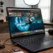 Laptop ASUS ProArt GoPro Edition menampilkan alur kerja kreator dengan kalibrasi warna layar dan kamera GoPro di meja.