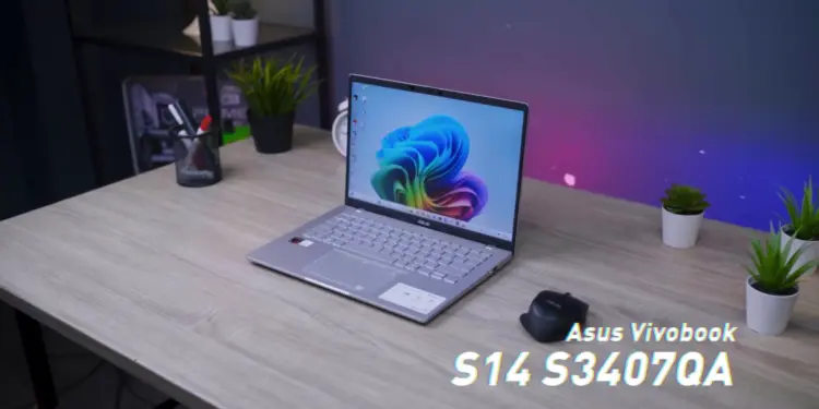 Laptop ASUS Vivobook S14 (S3407QA) dengan desain tipis dan fitur AI terbaru di atas meja kerja.