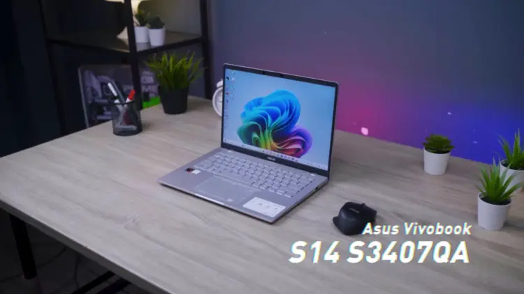 Laptop ASUS Vivobook S14 (S3407QA) dengan desain tipis dan fitur AI terbaru di atas meja kerja.
