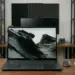 Laptop ASUS Zenbook S16 OLED UM5606GA di atas meja kerja dengan layar menampilkan wallpaper pegunungan