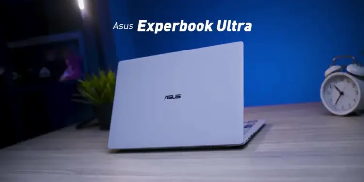 ASUS ExpertBook Ultra warna Morn Grey berbahan Magnesium Alloy dengan desain tipis dan premium di atas meja kerja.