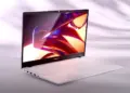 Laptop merk Advan berwarna putih dengan layar menyala terang menampilkan grafis warna-warni yang estetik.