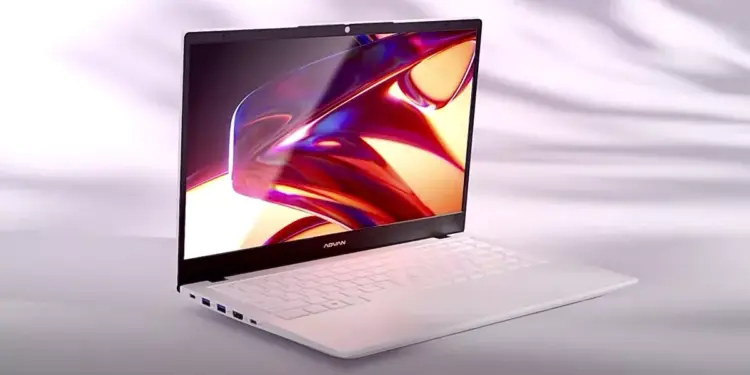 Laptop merk Advan berwarna putih dengan layar menyala terang menampilkan grafis warna-warni yang estetik.