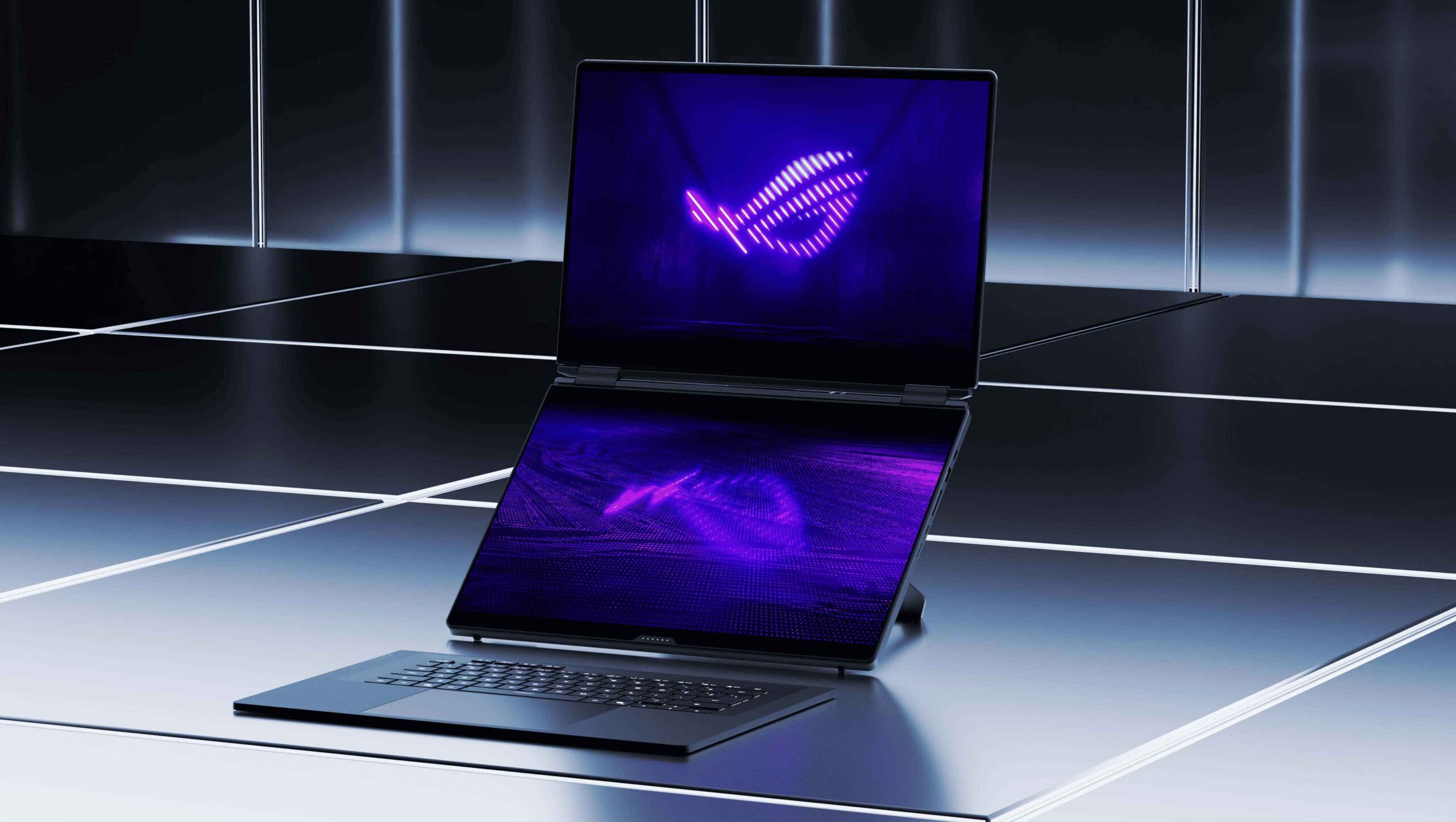 Laptop gaming ASUS ROG Zephyrus Duo dua layar dengan wallpaper logo ROG menyala warna ungu.