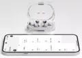 Earphone TWS Nothing Ear (3a) berwarna putih dengan casing transparan terhubung ke smartphone