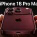 Tangan seseorang memegang iPhone 18 Pro Max warna merah gelap burgundy dengan modul triple camera tebal yang premium.