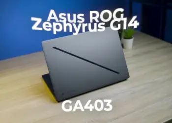 Desain premium bodi sasis CNC aluminum laptop gaming ASUS ROG Zephyrus G14 GA403 dengan fitur Slash Lighting minimalis di atas meja.
