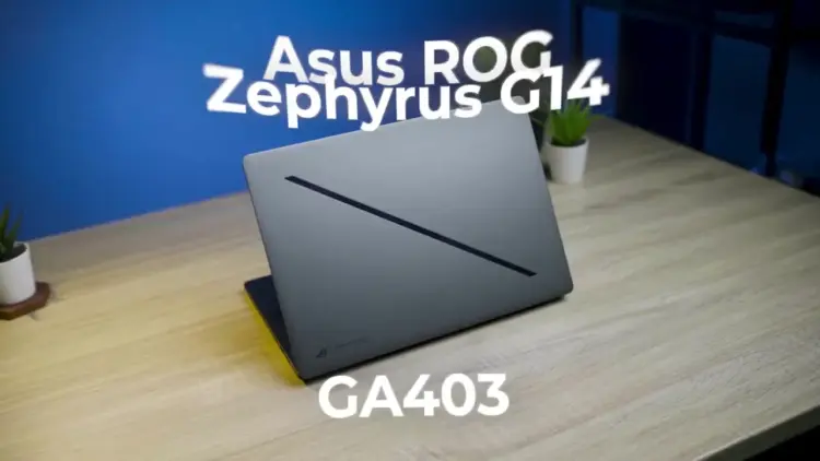 Desain premium bodi sasis CNC aluminum laptop gaming ASUS ROG Zephyrus G14 GA403 dengan fitur Slash Lighting minimalis di atas meja.