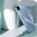 HP bekas 1 jutaan merk realme warna biru muda, tampak belakang dengan logo besar.