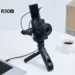 Kamera mirrorless Canon EOS R50 V terpasang pada tripod grip dengan layar terlipat ke atas untuk vlogging.
