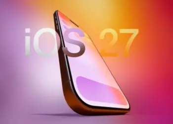 Ilustrasi smartphone dengan logo teks 'iOS 27' di latar belakang gradasi warna ungu dan oranye.