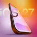 Ilustrasi smartphone dengan logo teks 'iOS 27' di latar belakang gradasi warna ungu dan oranye.