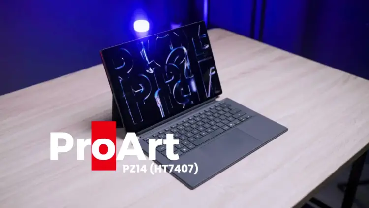 Laptop hibrida detachable ASUS ProArt PZ14 berwarna abu-abu tua di atas meja kayu dengan pencahayaan studio biru cobalt.