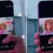 Seseorang mengambil foto selfie menggunakan HP kamera depan terbaik dengan tampilan autofocus wajah di layar.