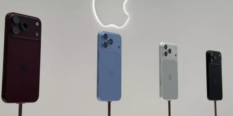 Deretan iPhone 18 Pro dan Pro Max dipajang di atas tiang pameran di bawah logo Apple yang menyala.